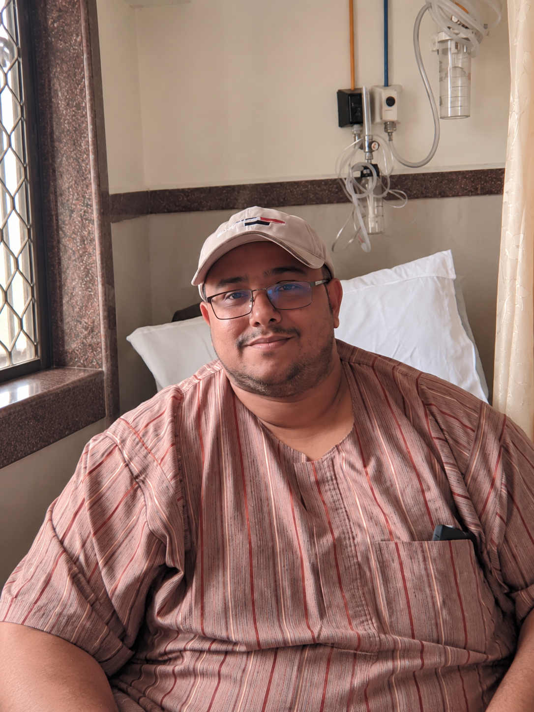 Mohd Abdul Kadir seated in a hospital room